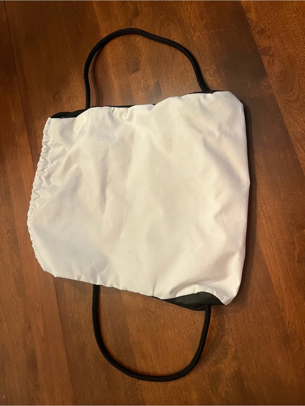 adidas White and Black Drawstring Backpack with Front Zip Pocket